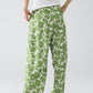 Pantalones anchos con cintura elástica y estampado floral verde