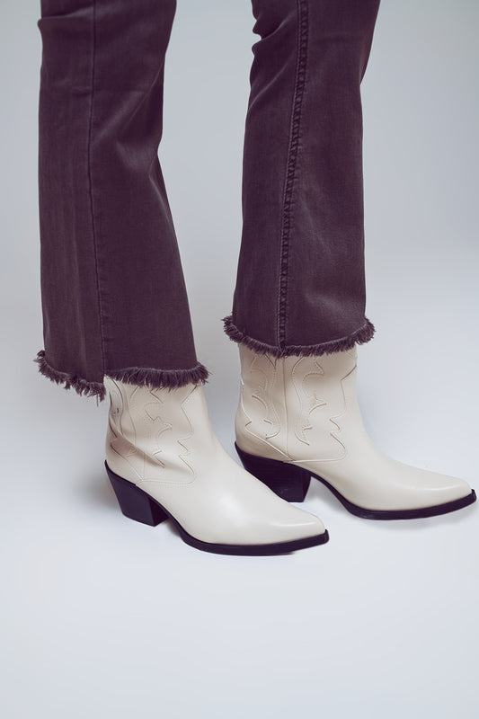 Vaqueros acampanados con dobladillo sin rematar en gris oscuro