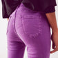 Flare jeans with raw hem edge in purple