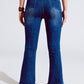 Flared Skinny Jeans With Raw Hem Edge In Mid Wash