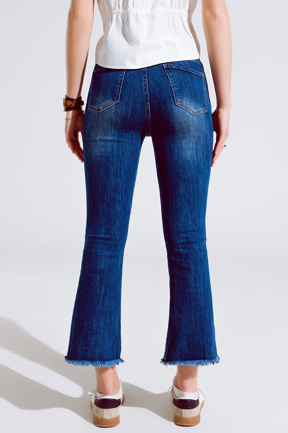 Flared Skinny Jeans With Raw Hem Edge In Mid Wash