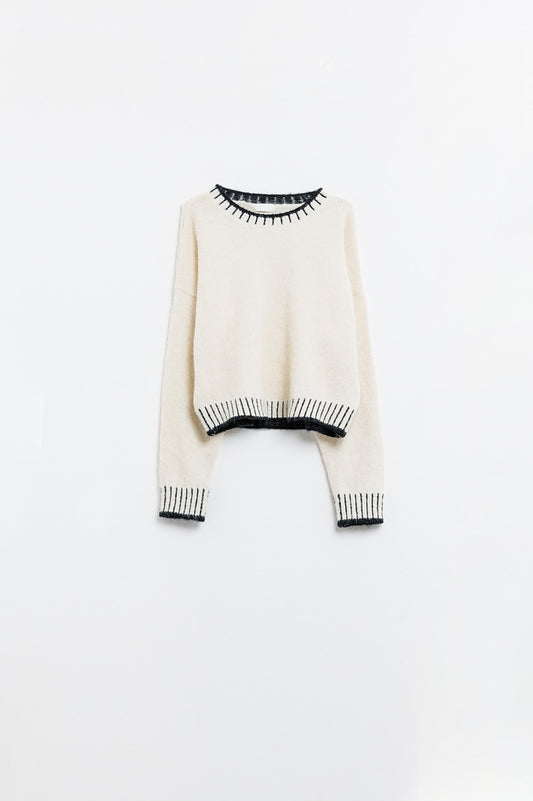 Fluffy cream sweater with ribbed detail at neck and hem