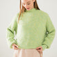 Q2 Fluffy light green sweater with high neck and balloon sleeves