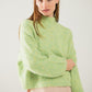 Fluffy light green sweater with high neck and balloon sleeves