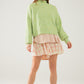 Fluffy light green sweater with high neck and balloon sleeves