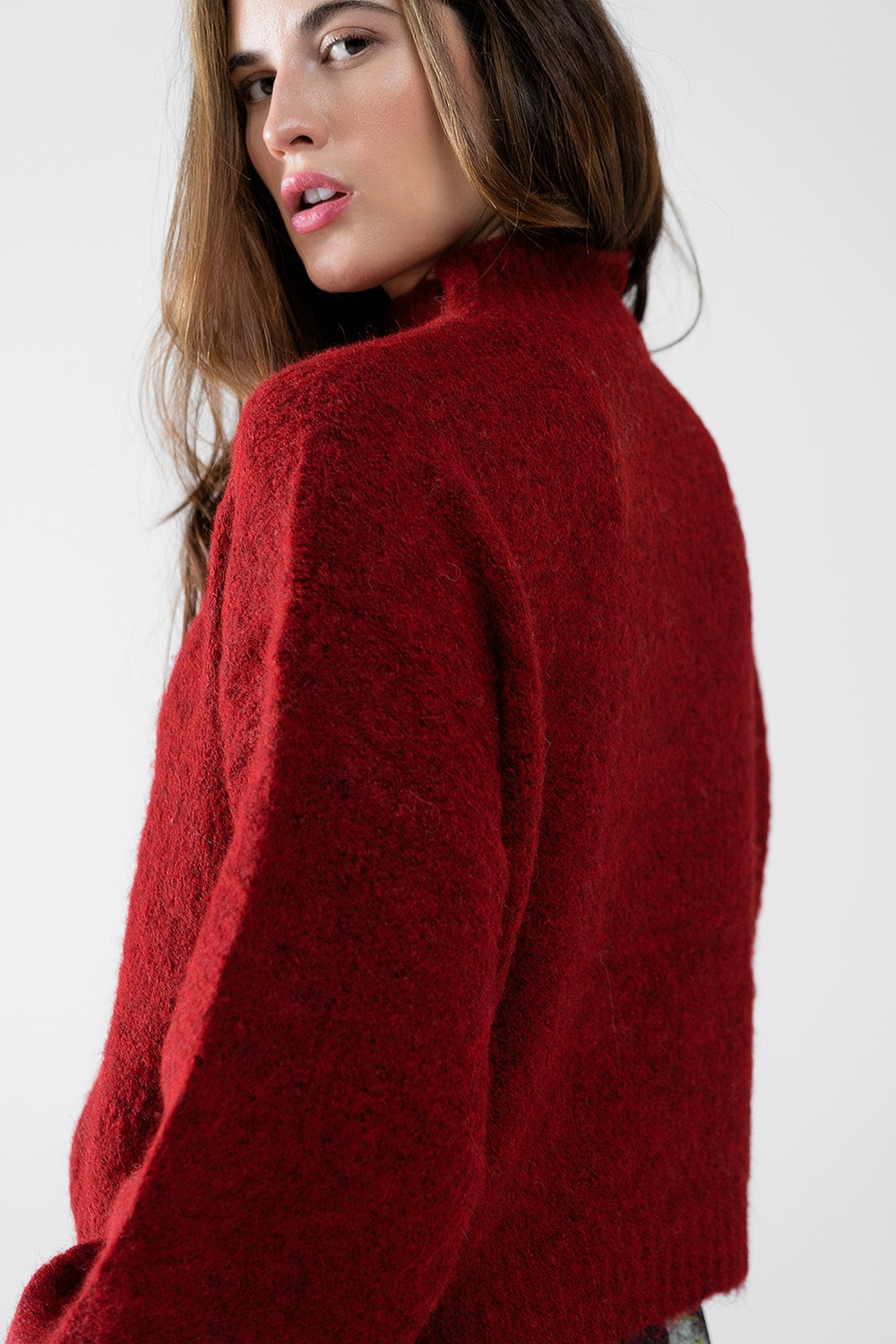 Fluffy red sweater with high neck and balloon sleeves