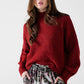 Q2 Fluffy red sweater with high neck and balloon sleeves