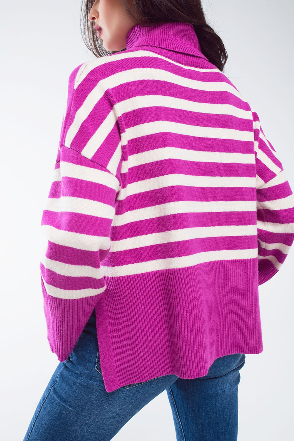 Fuchsia oversized trutleneck sweater with white stripes and splits on the side