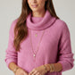fuchsia ribbed knit sweater with a roll neck