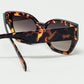 geometric polarized sunglasses with gradient dark lenses and tortoise shell