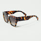 geometric polarized sunglasses with gradient dark lenses and tortoise shell