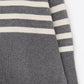 Gray oversized turtleneck sweater with white stripes and splits on the side