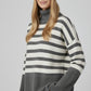 Gray oversized turtleneck sweater with white stripes and splits on the side