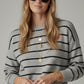 gray striped knit sweater with red heart detail