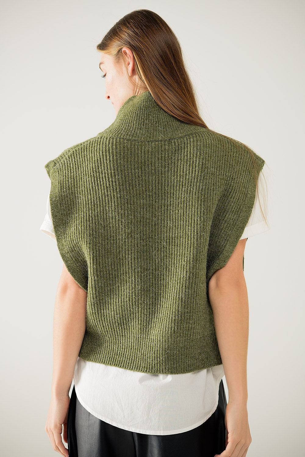 Green sleeveless turtleneck sweater with zipper closure