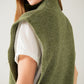 Green sleeveless turtleneck sweater with zipper closure