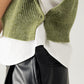 Green sleeveless turtleneck sweater with zipper closure