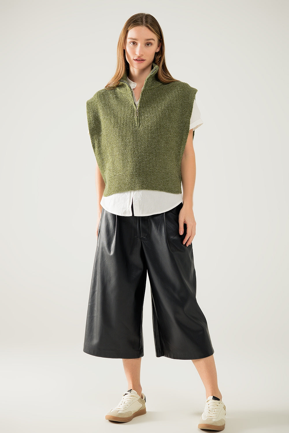 Green sleeveless turtleneck sweater with zipper closure