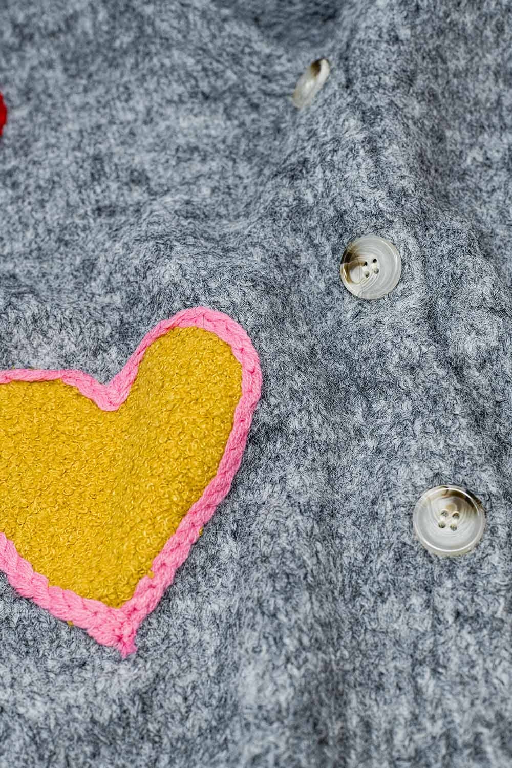 Grey knitted cardigan with embroidered hearts