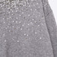 Grey soft knit sweater embellished with sequins on the front