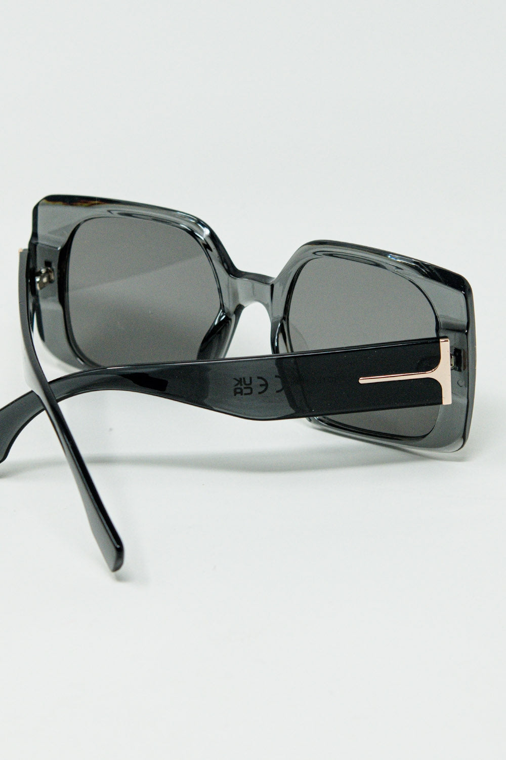 Grey square sunglasses with gold detail on the side