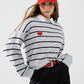 Q2 Grey striped sweater with red heart detail