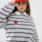 Grey striped sweater with red heart detail