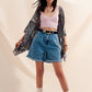 High waisted pleated denim shorts in mid wash