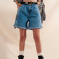 High waisted pleated denim shorts in mid wash