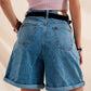 High waisted pleated denim shorts in mid wash