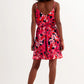 Hot pink short dress with flower print and straps