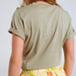 Khaki T-Shirt with golden button detail on shoulder