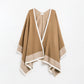 Q2 Knitted poncho in camel with ecru trim