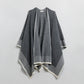 Knitted poncho in grey with ecru trim