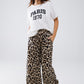 Pantalones con estampado de leopardo, cordón y bolsillos