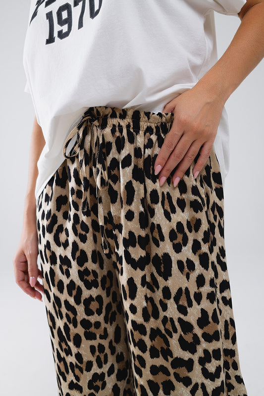 Pantalones con estampado de leopardo, cordón y bolsillos