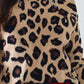 Leopard sweater with red detail on the neck and sleeves