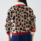 Leopard sweater with red detail on the neck and sleeves