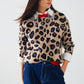 Q2 Leopard sweater with red detail on the neck and sleeves