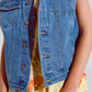 Light wash denim vest with rhinestone detail on the collar