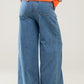 light wash extra wide leg jeans with pleats