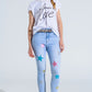 Light Wash Skinny Jeans With Stars On The Legs