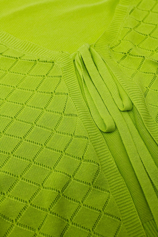 Cárdigan color lima con estampado de rombos y cierre de lazo