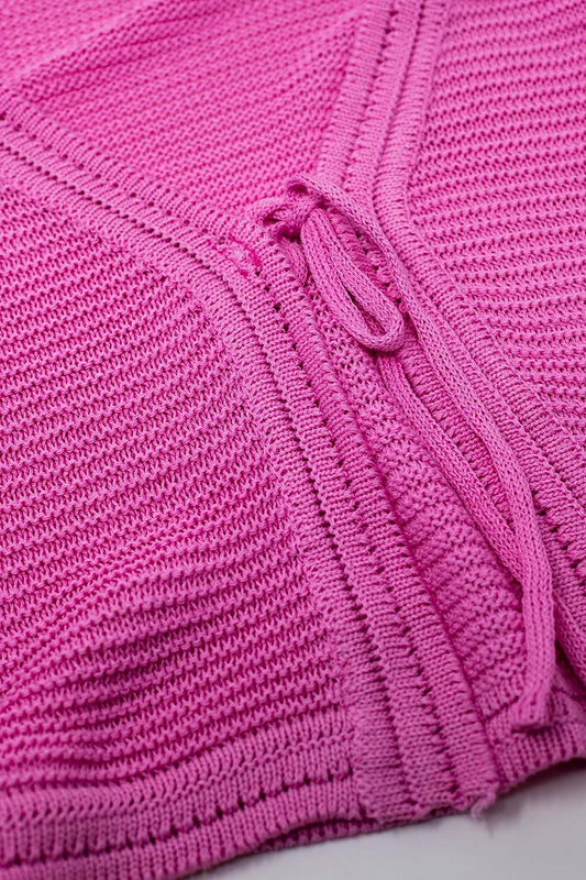 Cárdigan de punto de manga larga acampanada en color fucsia con detalle de nudo