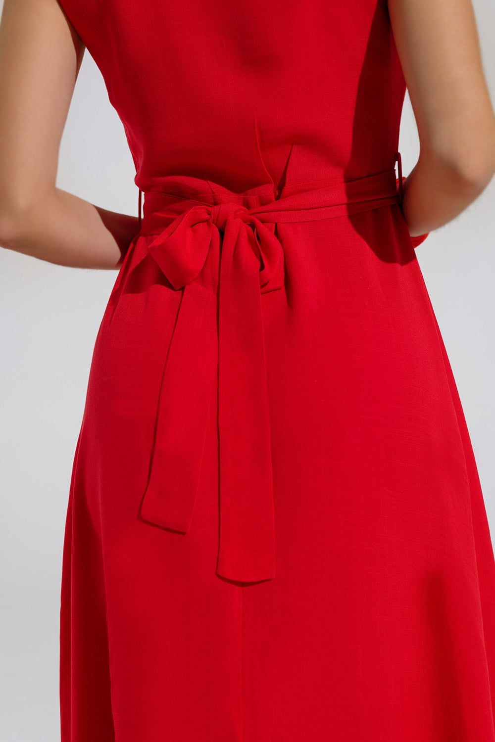 Long red dress with ruffle and button detail