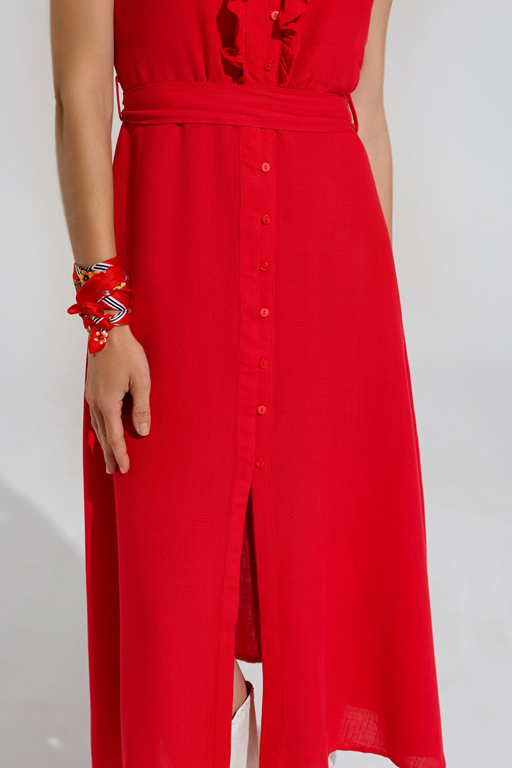 Long red dress with ruffle and button detail