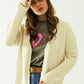 Q2 Long sleeves creme cardigan with front closure with buttons