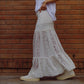 Long white lace skirt fitted at the waist