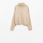 Loose beige sweater with dropped sleeves