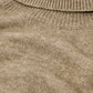 Loose beige sweater with dropped sleeves